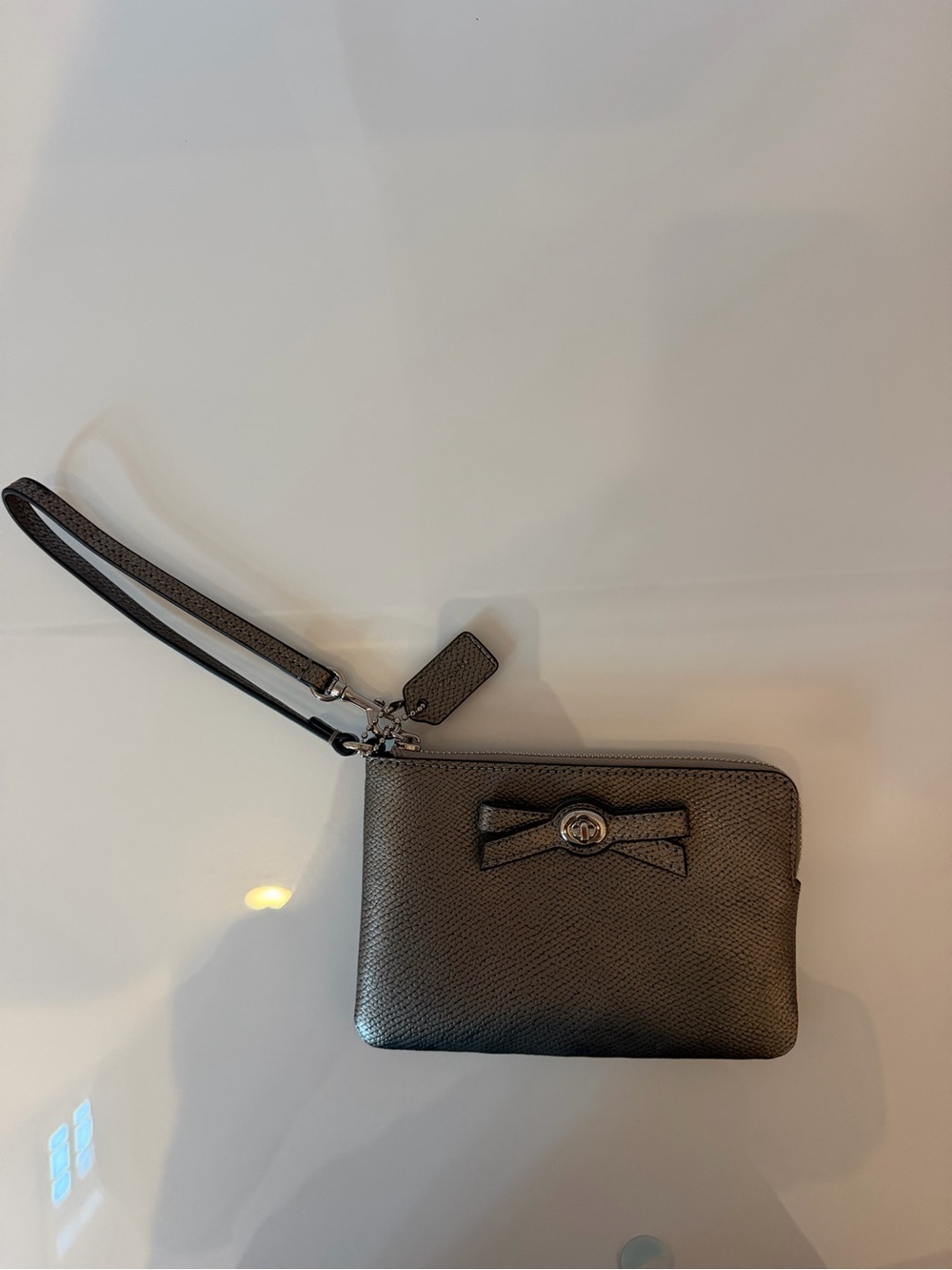 Coach Men's Metallic Gray Leather Wristlet with Bow Accent